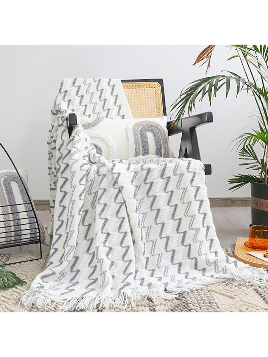 Stay warm and cozy with our Nordic Style Knitted Wave Stripe Blanket